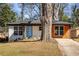 Updated home with a blue front door and mixed siding at 1244 Lorenzo Sw Dr, Atlanta, GA 30310