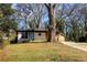 Renovated home with mixed siding and a large shade tree at 1244 Lorenzo Sw Dr, Atlanta, GA 30310