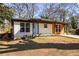 Charming single-story home featuring a modern brick facade, updated siding, and a well-manicured front yard at 1244 Lorenzo Sw Dr, Atlanta, GA 30310