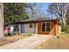 Charming single-story home featuring a modern brick facade, updated siding, and a well-manicured front yard at 1244 Lorenzo Sw Dr, Atlanta, GA 30310