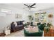 Bright living room featuring a ceiling fan, stylish furniture, and natural light at 1244 Lorenzo Sw Dr, Atlanta, GA 30310