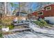 Multi-tiered back deck with gray wood, modern decor, and lush landscaping at 3398 Lori Ln, Atlanta, GA 30340