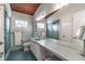 Bathroom featuring double sink vanity, and tiled walls at 3398 Lori Ln, Atlanta, GA 30340