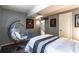 This bedroom has a cozy reading nook, stylish decor, and neutral walls at 3398 Lori Ln, Atlanta, GA 30340
