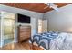 The main bedroom features stylish hardwood flooring, windows, and a modern ceiling fan at 3398 Lori Ln, Atlanta, GA 30340