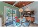 Cozy dining area with an eye-catching chandelier next to the outdoor patio at 3398 Lori Ln, Atlanta, GA 30340