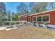 Charming home exterior featuring a carport, large windows, and a well-manicured lawn at 3398 Lori Ln, Atlanta, GA 30340