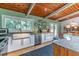Contemporary kitchen with white cabinets, stainless appliances, and a view of the outdoors at 3398 Lori Ln, Atlanta, GA 30340