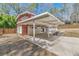 A covered back patio with brick accents, concrete flooring, and a fenced-in yard at 3398 Lori Ln, Atlanta, GA 30340