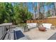 Secluded patio area with comfortable white couches, perfect for outdoor relaxation and entertaining at 3398 Lori Ln, Atlanta, GA 30340