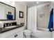 Bright bathroom with a sleek vanity, modern fixtures, and tub with tile surround at 3470 Serenade Nw Commons, Kennesaw, GA 30152