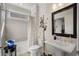 Bright bathroom featuring modern fixtures, a stylish mirror, and a tub-shower combination at 3470 Serenade Nw Commons, Kennesaw, GA 30152