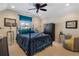 Cozy bedroom featuring carpet, and ceiling fan with coordinated décor at 3470 Serenade Nw Commons, Kennesaw, GA 30152