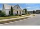 Inviting clubhouse with manicured lawn and seating, blending community charm at 3470 Serenade Nw Commons, Kennesaw, GA 30152