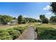 Manicured landscaping and mature trees line the walking paths of this lovely residential community at 3470 Serenade Nw Commons, Kennesaw, GA 30152