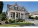 Attractive home featuring a manicured lawn, cozy porch, and convenient two-car garage at 3470 Serenade Nw Commons, Kennesaw, GA 30152