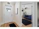 Bright foyer with hardwood floors, white trim, and a view into the study at 3470 Serenade Nw Commons, Kennesaw, GA 30152