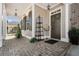 Inviting front porch featuring a brick floor and a beautifully decorated entrance at 3470 Serenade Nw Commons, Kennesaw, GA 30152