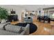 Open concept living room and dining room, featuring hardwood floors and views of the kitchen at 3470 Serenade Nw Commons, Kennesaw, GA 30152