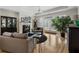 Cozy living room featuring a fireplace, hardwood floors, and large windows for natural light at 3470 Serenade Nw Commons, Kennesaw, GA 30152