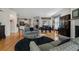 Spacious living room with hardwood floors, fireplace, and views into the dining room and kitchen at 3470 Serenade Nw Commons, Kennesaw, GA 30152