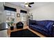 Comfortable study featuring hardwood floors, natural light, and a stylish blue sofa at 3470 Serenade Nw Commons, Kennesaw, GA 30152