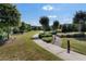 Scenic walkway through the community's landscape with lush greenery and mature trees at 3470 Serenade Nw Commons, Kennesaw, GA 30152