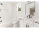Bright bathroom featuring a white vanity, quartz countertop, a large mirror, and a tiled shower/bathtub combination at 185 Marion # A, Atlanta, GA 30307