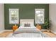 Serene bedroom with natural light, hardwood floors, and modern decor at 185 Marion # A, Atlanta, GA 30307