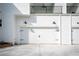 Modern garage with white doors, matte black hardware and lights accenting the clean design on the exterior at 185 Marion # A, Atlanta, GA 30307