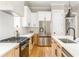 Bright kitchen features stainless steel appliances, custom cabinets, and stone countertops at 185 Marion # A, Atlanta, GA 30307