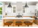 Modern kitchen with stainless steel appliances, a large island with seating, and bright lighting at 185 Marion # A, Atlanta, GA 30307