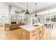 Open living room flows into kitchen with hardwood floors, fireplace and ceiling beams at 185 Marion # A, Atlanta, GA 30307