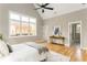 Vaulted ceiling and hardwood floors in bedroom lead to ensuite bathroom and walk in closet at 185 Marion # A, Atlanta, GA 30307