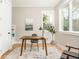 Sunlit office space features a modern desk, chair, and a large window with a view of the outdoors at 185 Marion # A, Atlanta, GA 30307