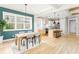 Open floorplan connecting the dining room and kitchen with hardwood floors and modern design at 185 Marion # A, Atlanta, GA 30307
