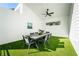 Inviting outdoor patio with a modern dining table set on artificial grass, providing an enjoyable outdoor space at 185 Marion # A, Atlanta, GA 30307