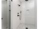 Modern walk-in shower has sleek tile surround and updated shower head at 185 Marion # A, Atlanta, GA 30307