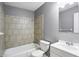 This bathroom features a shower/tub combo, and a white vanity at 2235 Chamois Ct, Decatur, GA 30035
