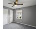 This cozy bedroom has gray walls, carpet and a ceiling fan at 2235 Chamois Ct, Decatur, GA 30035