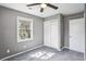 This bedroom has a closet, window, carpet and ceiling fan at 2235 Chamois Ct, Decatur, GA 30035