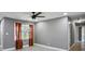 Bright living room featuring sleek floors, modern lighting, and red curtains at 2235 Chamois Ct, Decatur, GA 30035
