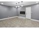 Open-concept living room with fireplace, modern lighting, white trim, and neutral colors at 2235 Chamois Ct, Decatur, GA 30035