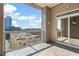 Balcony view with glass railing overlooking a city skyline and brick buildings, creating an inviting outdoor living space at 2881 Peachtree Ne Rd # 704, Atlanta, GA 30305