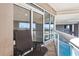 View of the pool, chairs and city beyond the balcony, showing the building's many amenities at 2881 Peachtree Ne Rd # 704, Atlanta, GA 30305