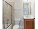 Tiled bathroom featuring modern fixtures, a glass shower door, and a sleek vanity, providing a refreshing space at 2881 Peachtree Ne Rd # 704, Atlanta, GA 30305