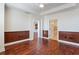 Spacious bedroom with hardwood floors and neutral paint, shows a bathroom and kitchen nearby at 2881 Peachtree Ne Rd # 704, Atlanta, GA 30305