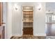 Hallway view showing an open closet offering ample storage and well-appointed hallway lighting at 2881 Peachtree Ne Rd # 704, Atlanta, GA 30305