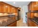 Kitchen features wooden cabinets, granite countertops, tile backsplash, tile flooring, stainless steel appliances, and wine storage at 2881 Peachtree Ne Rd # 704, Atlanta, GA 30305