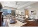 Bright living room with fireplace, comfortable seating, and expansive windows offering city views at 2881 Peachtree Ne Rd # 704, Atlanta, GA 30305